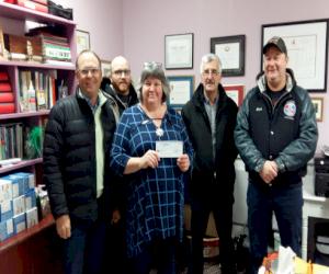 Pictured L-R: Rick Benoit, Chris Arsenault, Evelyn McNulty (Romero House), Ken Matthews and Dickie McGuire